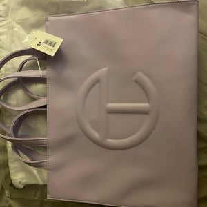 Medium Lavender Telfar bag selling for college books